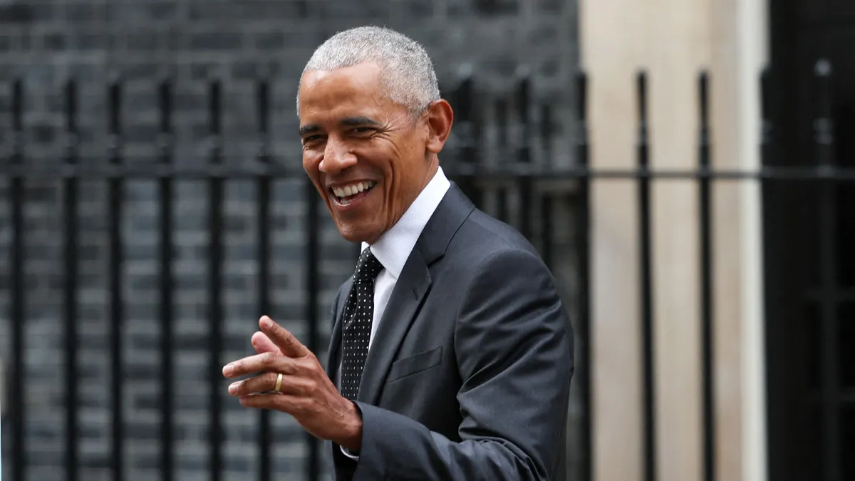 Former President Barack Obama walking outside 10 Downing Street in London.