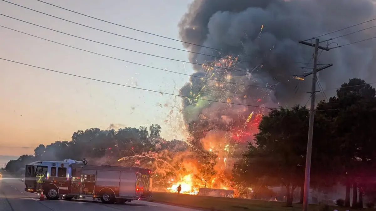 Firetruck near fireworks stand blaze