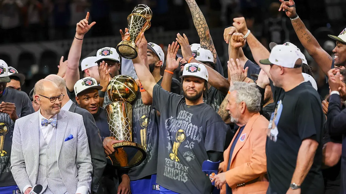New York Knicks guard Jalen Brunson celebrating with teammates on basketball court.