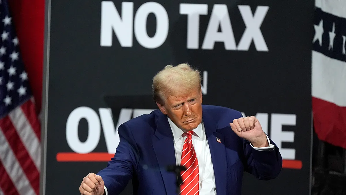 President Donald Trump dancing at a campaign event at Cobb Energy Performing Arts Centre in Atlanta