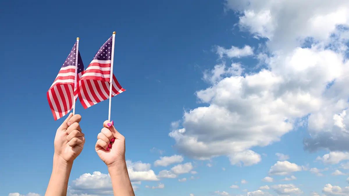 American flags on sky background. Independence Day concept. USA holiday. For Flag Day use