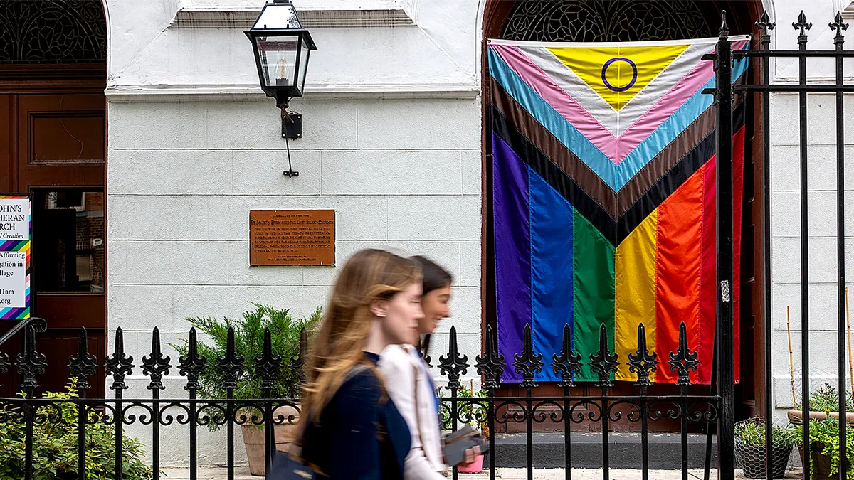 Progress Pride flag hanging outside St. John's Lutheran Church near Stonewall Monument in New York City
