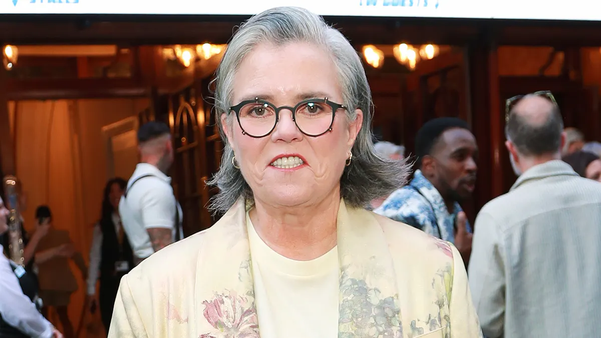 Rosie O'Donnell smiling at the London Palladium during Evita press night