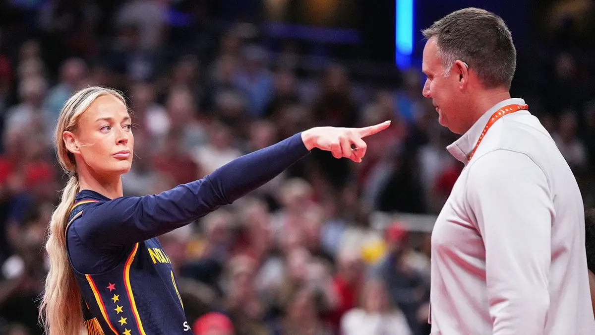 Indiana Fever guard Sophie Cunningham pointing at Phoenix Mercury forward-guard DeWanna Bonner during a basketball game.