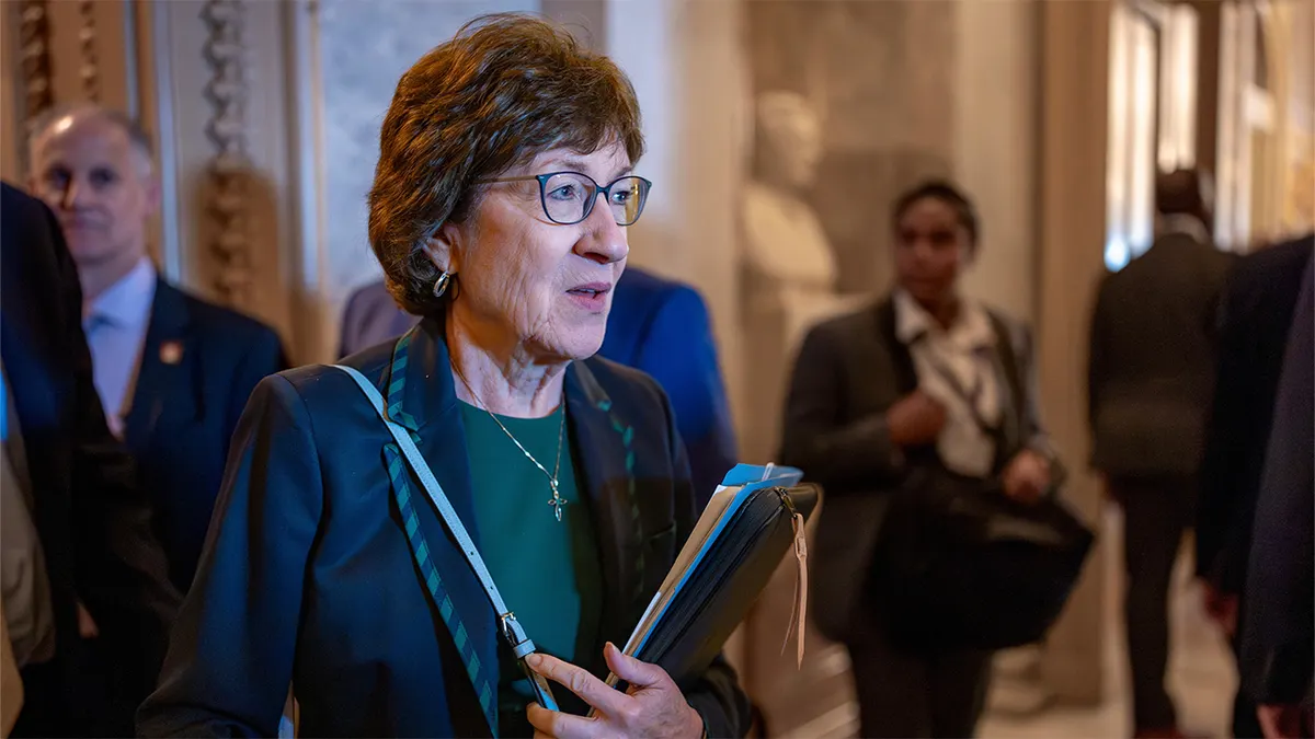 Sen. Susan Collins walking inside the Capitol chamber in Washington
