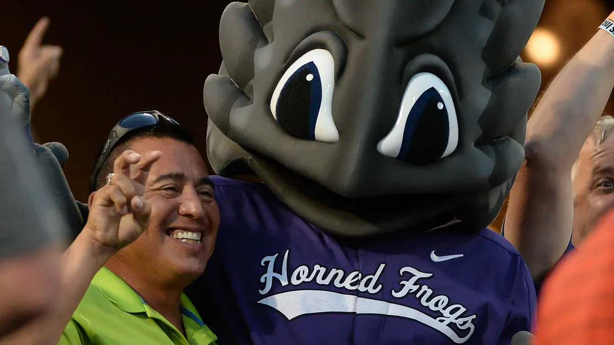 TCU Horned Frogs mascot cheering with a fan at TD Ameritrade Park Omaha