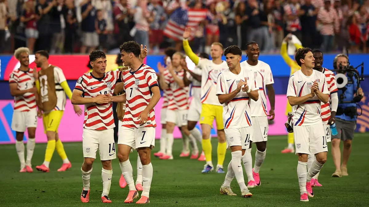 U.S. men's national team players celebrate after a soccer match