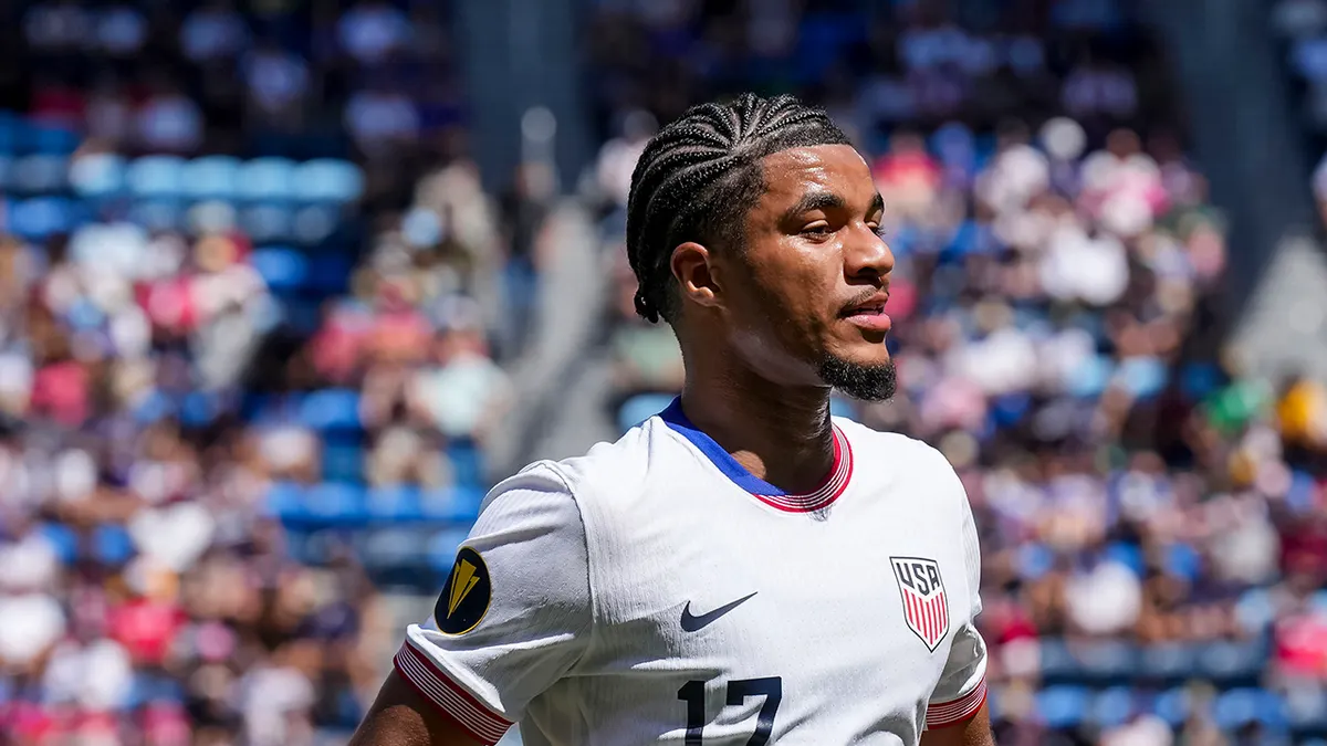 United States forward Malik Tillman celebrates after scoring a goal during a soccer match.