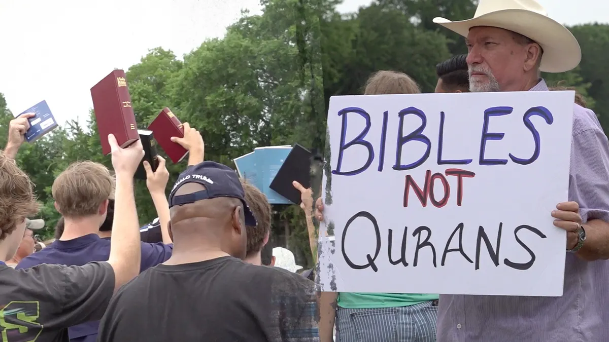 A person handing out a Bible in Texas.
