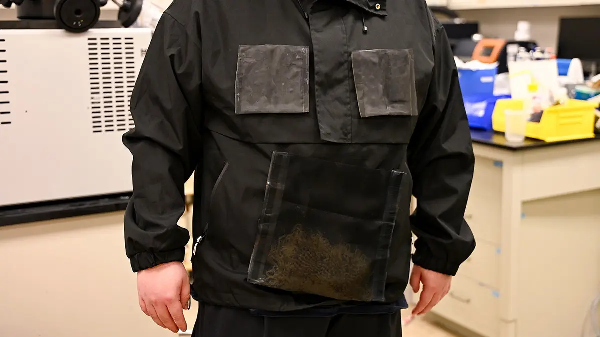 A researcher wears a jacket that creates drinking water.