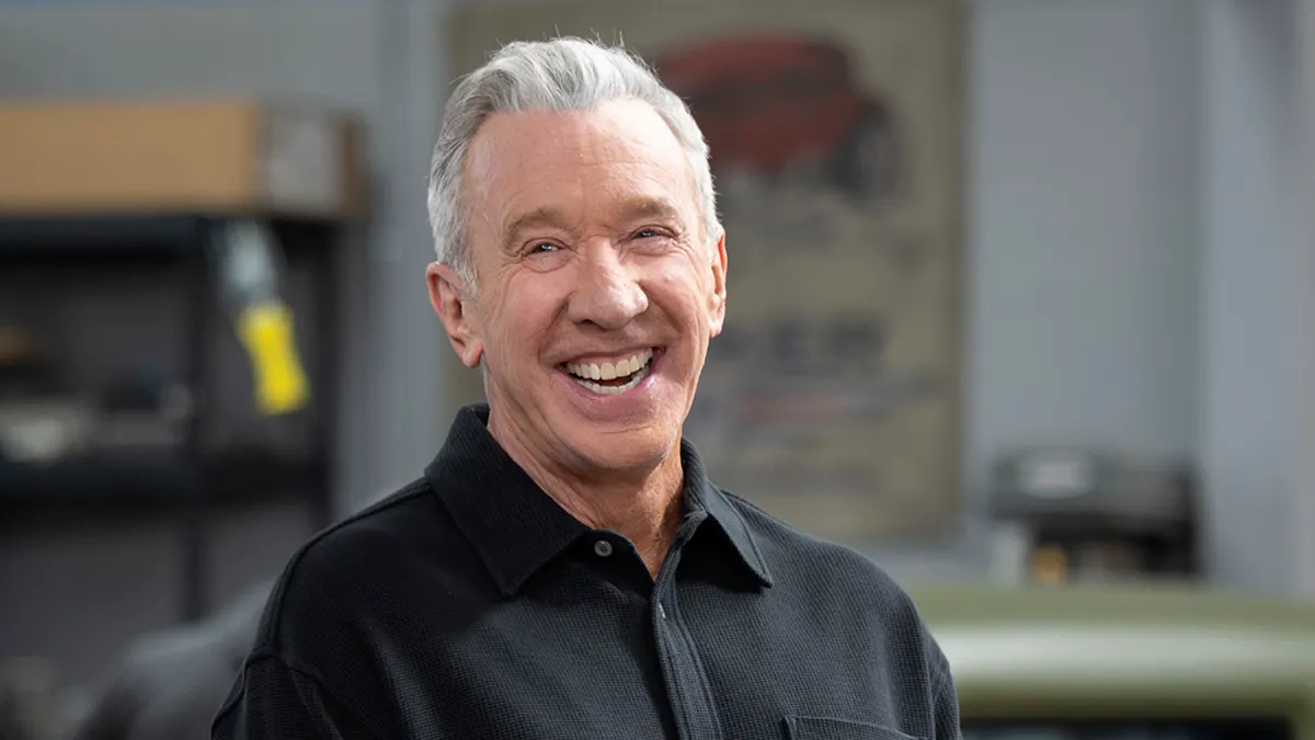 Tim Allen laughing in a studio setting