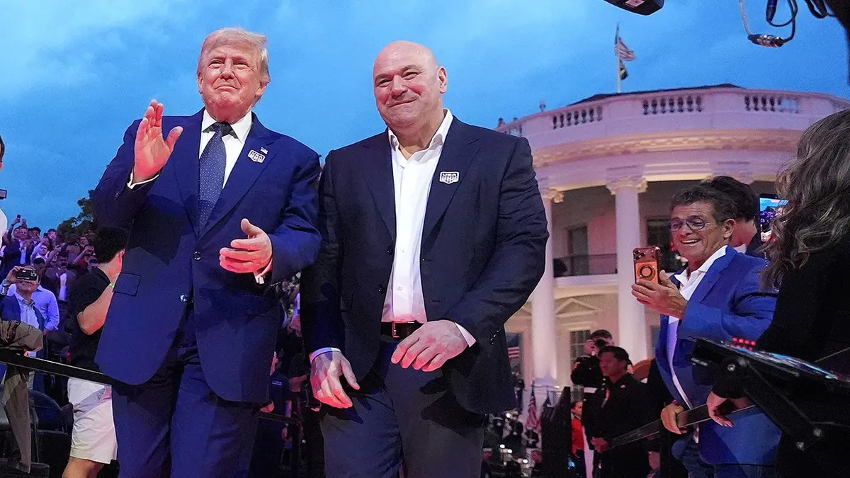 President Donald Trump and Dana White walking on the South Lawn of the White House