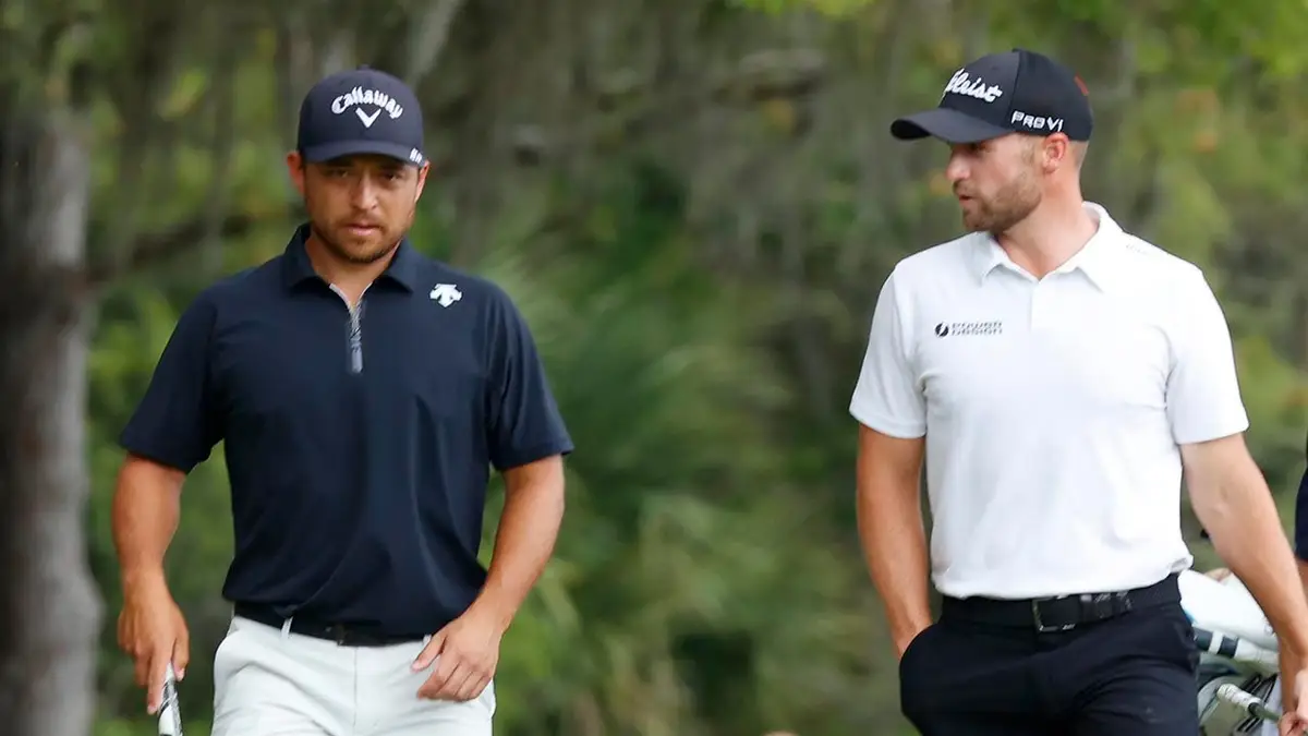 PGA golfers Xander Schauffele and Wyndham Clark walking the 3rd hole at TPC Sawgrass