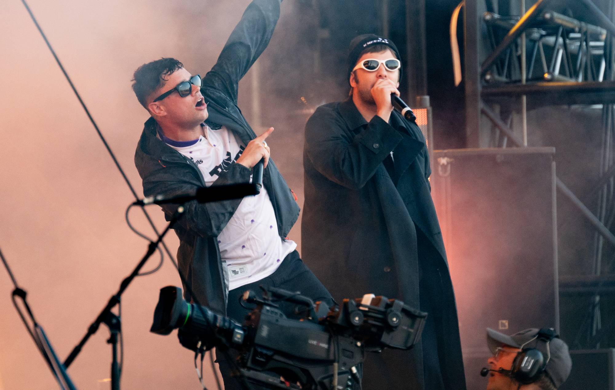Grian Chatten of Fontaines D.C. joins Móglaí Bap of Kneecap at Wythenshawe Park on August 15, 2025 in Wythenshawe, England. (Photo by Shirlaine Forrest/WireImage)