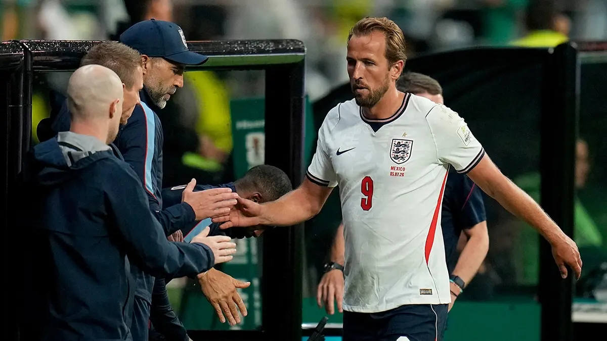 Harry Kane walks off the field during a soccer match in Mexico City.