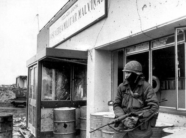 An Argentinian army soldier stands guard at an air base in Puerto Argentino during the Falkland War (Guerra de Las Malvinas) between Argentina and Britain, May 1982. Some 1,000 people died during the war that began with Argentina