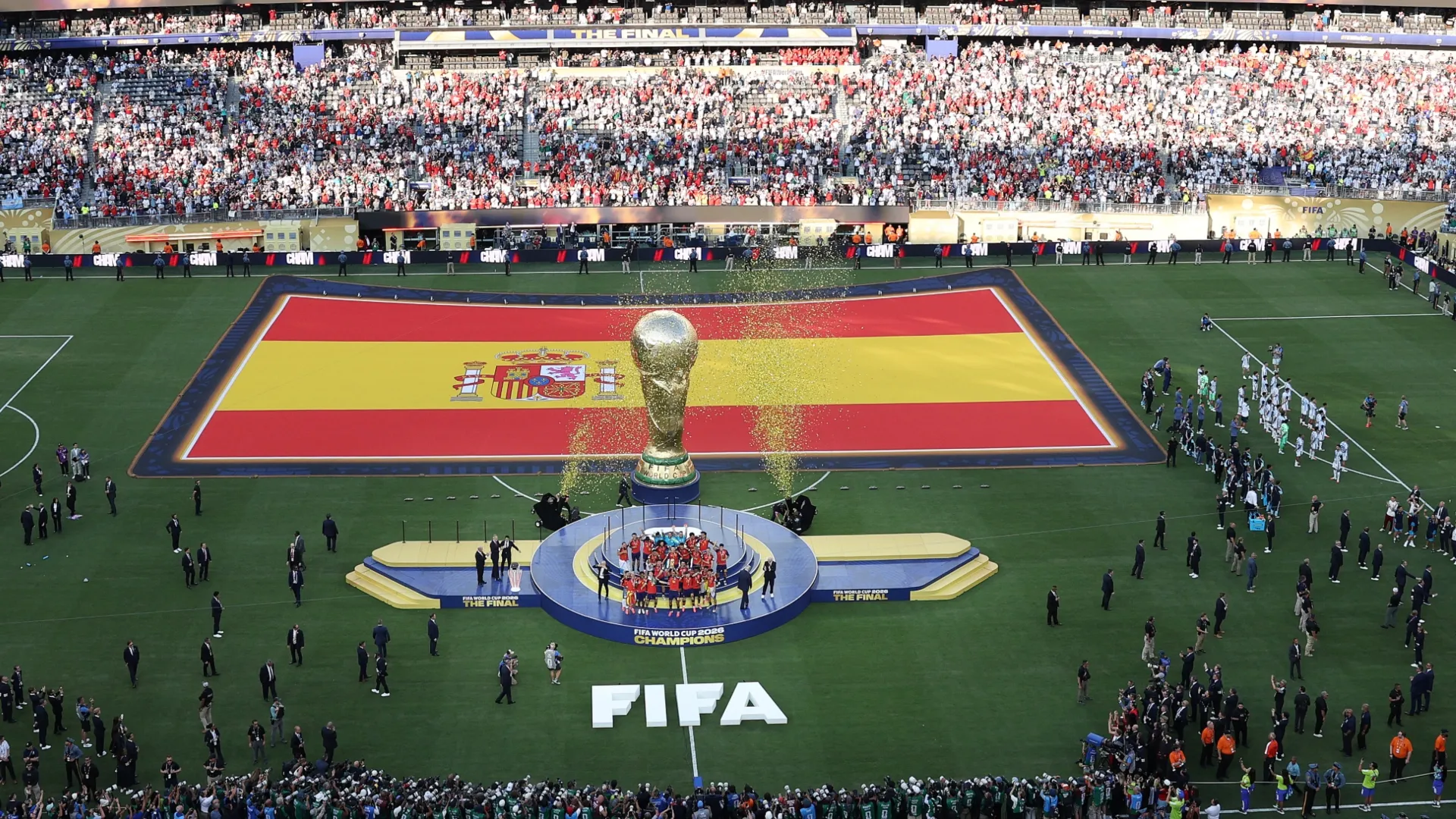 Spain lifts the FIFA World Cup Winner’s Trophy while Argentina national team looks at the fans.