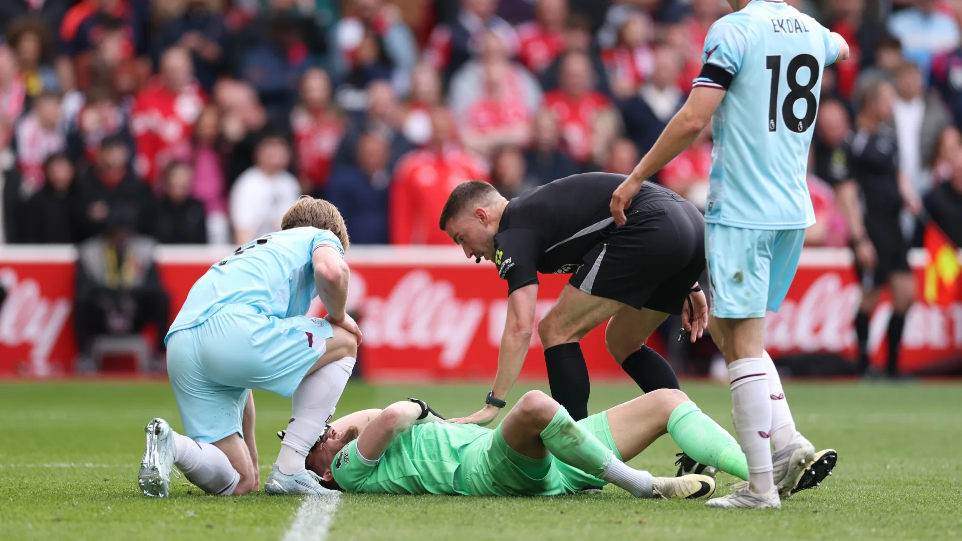 Martin Dubravka of Burnley recieves treatment for a head injury.