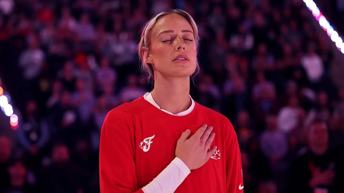 Sophie Cunningham of the Indiana Fever standing for the national anthem at Chase Center