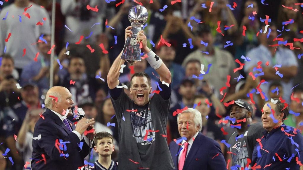 Tom Brady hoists the Vince Lombardi Trophy