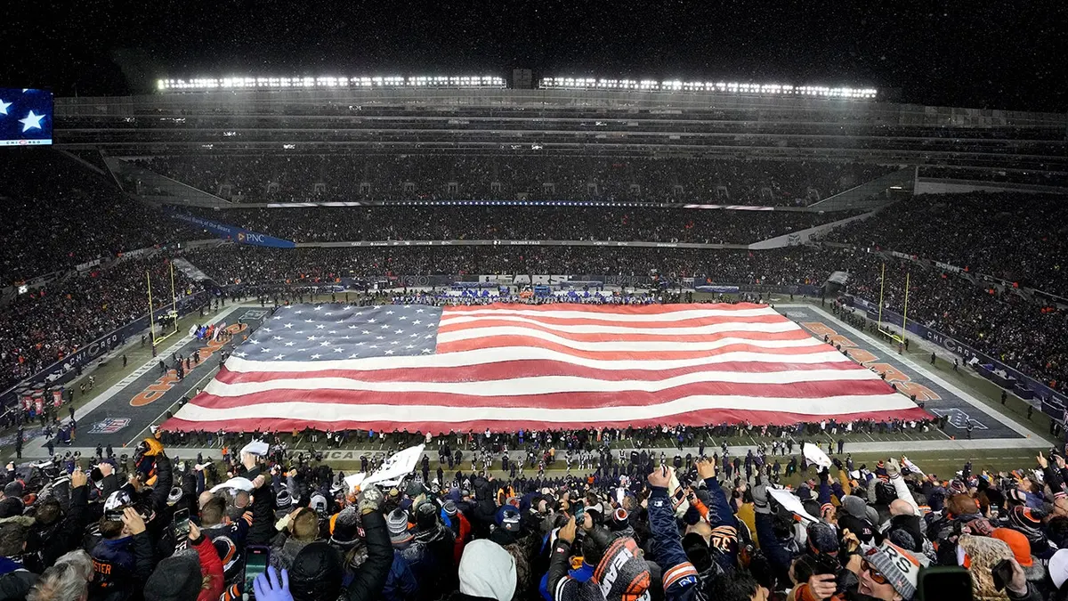 American flag displayed on the field at Soldier Field in Chicago