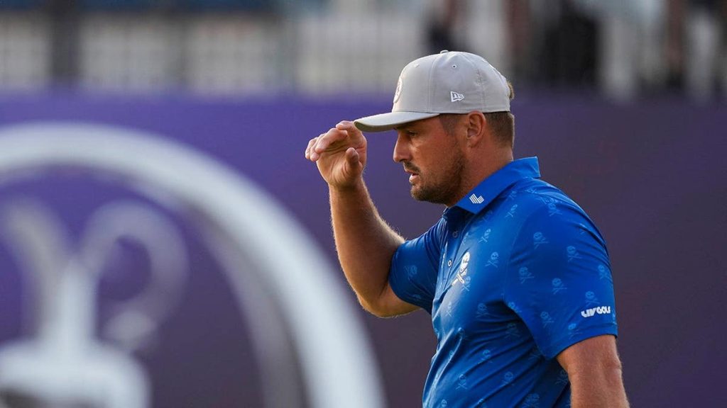 Bryson DeChambeau stands on the 18th green at Royal Birkdale Golf Club.