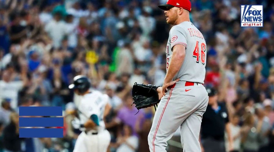 Reds pitcher gets irate at umpire for getting in defender