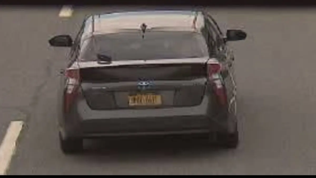image shows car with NY tags