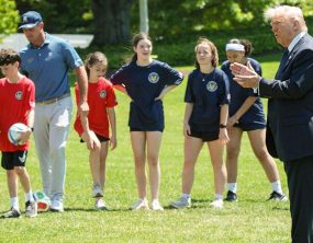 Pat McAfee attends sporting event with President Trump wearing jeans and a backwards cap