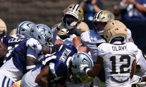 A massive brawl at Cowboys and Saints joint practice includes punches and helmets thrown and WWE moves