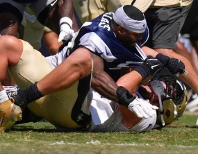 NFL fines Saints and Cowboys $500K for practice brawl, but fights won't stop unless players get fined