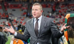 Kirk Herbstreit and his former gymnast wife have four boys thanks to handstands on the bed