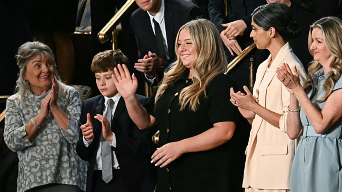 Payton McNabb, former high school athlete, stands as President Donald Trump speaks at the U.S. Capitol.