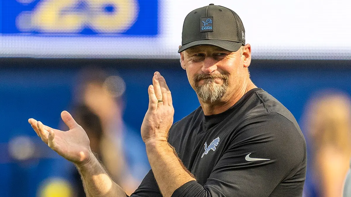 Dan Campbell cheers on the field during pregame warmups at SoFi Stadium.