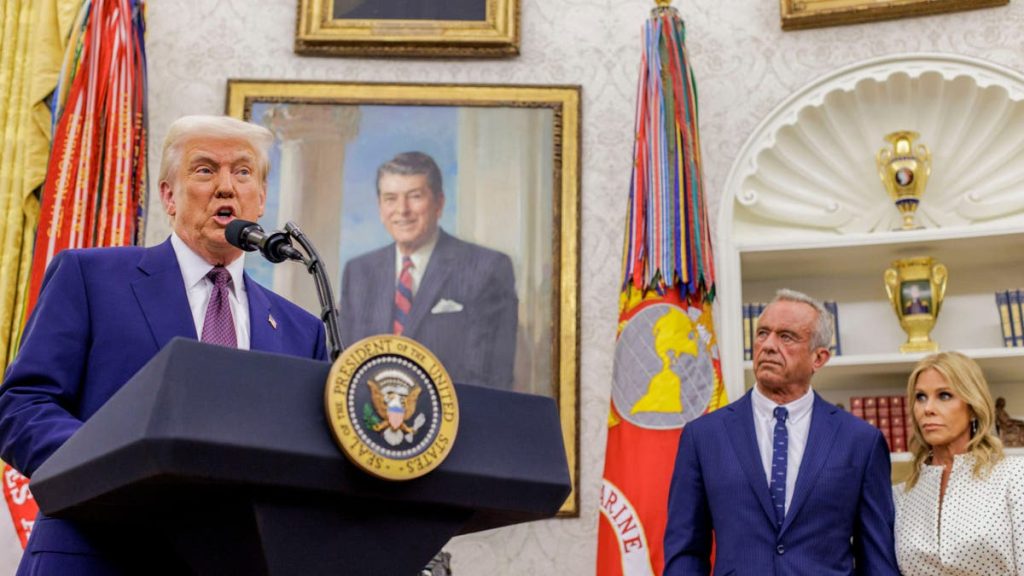 President Donald Trump, from left, Robert F. Kennedy Jr., secretary of Health and Human Services (HHS), and his wife actress Cheryl Hines during a ceremony in the Oval Office of the White House.