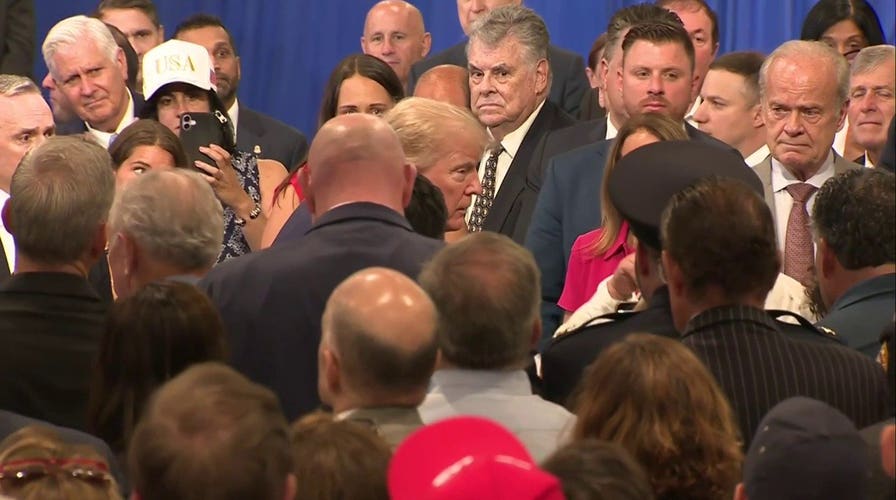 President Trump walks offstage to comfort grieving parents