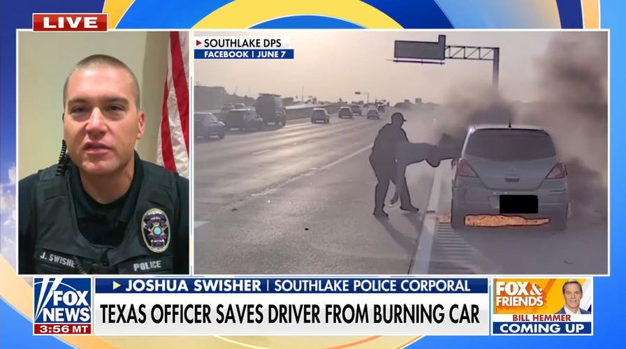 Texas officer saves driver from burning car in dramatic video