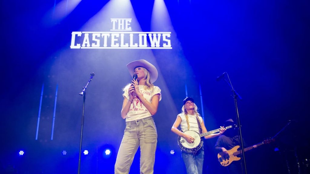 Lily Balkcom and Powell Balkcom perform on stage at The O2 Arena in London.