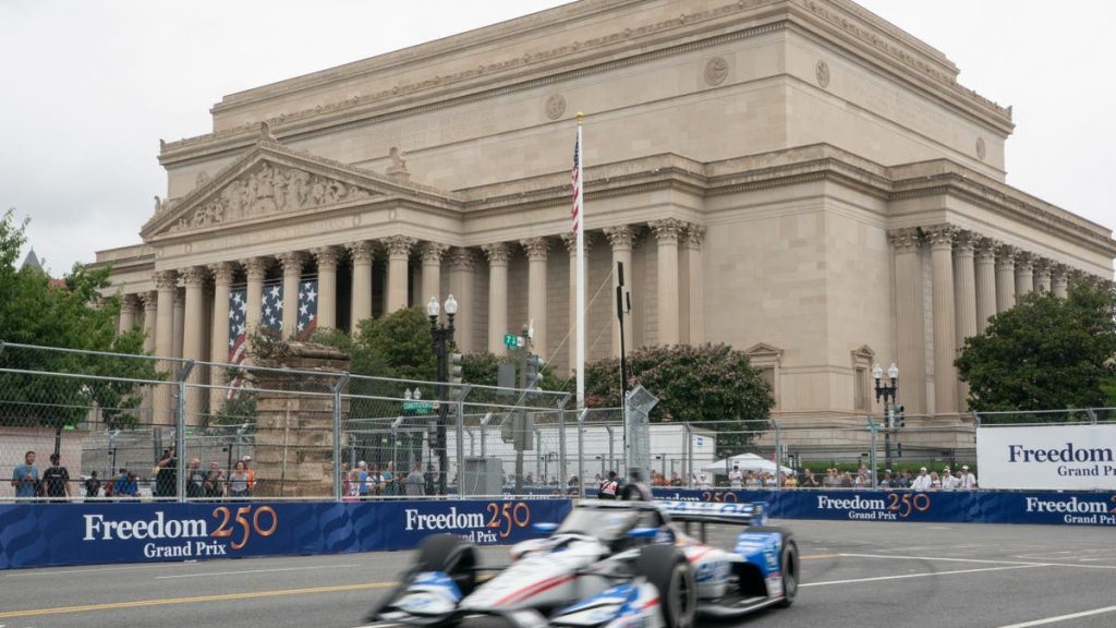 Spectators watch an IndyCar practice run in Washington, D.C.