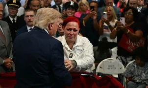 President Donald Trump exits speech stage to hug Jacob Freytes' grieving parents