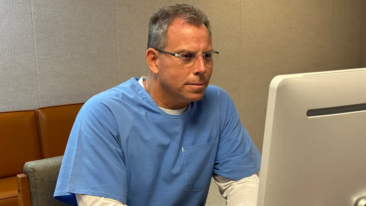 Parole hearing attended by Erik Menendez from a desktop computer.