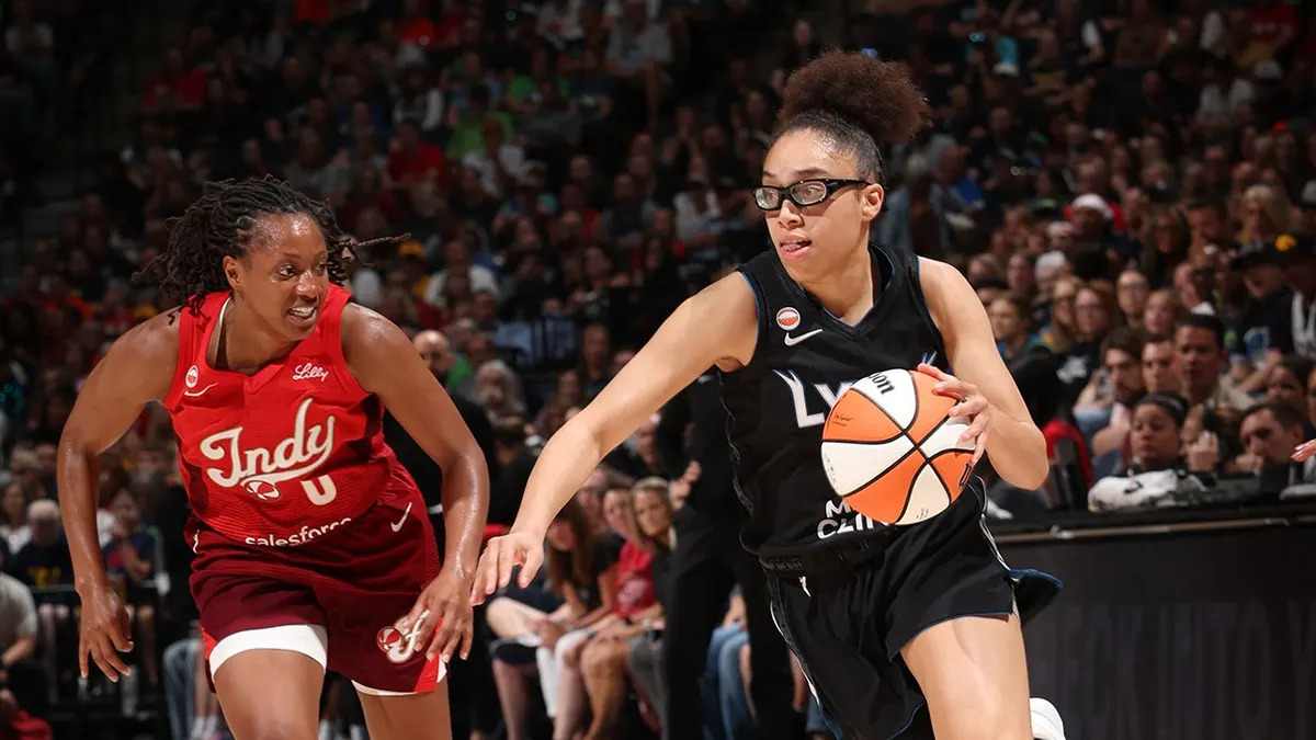 Olivia Miles drives to the basket during a game at Target Center.