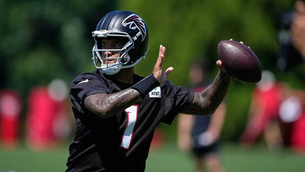 Tua Tagovailoa runs drills during Atlanta Falcons training camp practice.