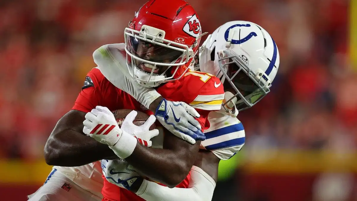 Jalen Royals of the Kansas City Chiefs is tackled by Sauce Gardner of the Indianapolis Colts.