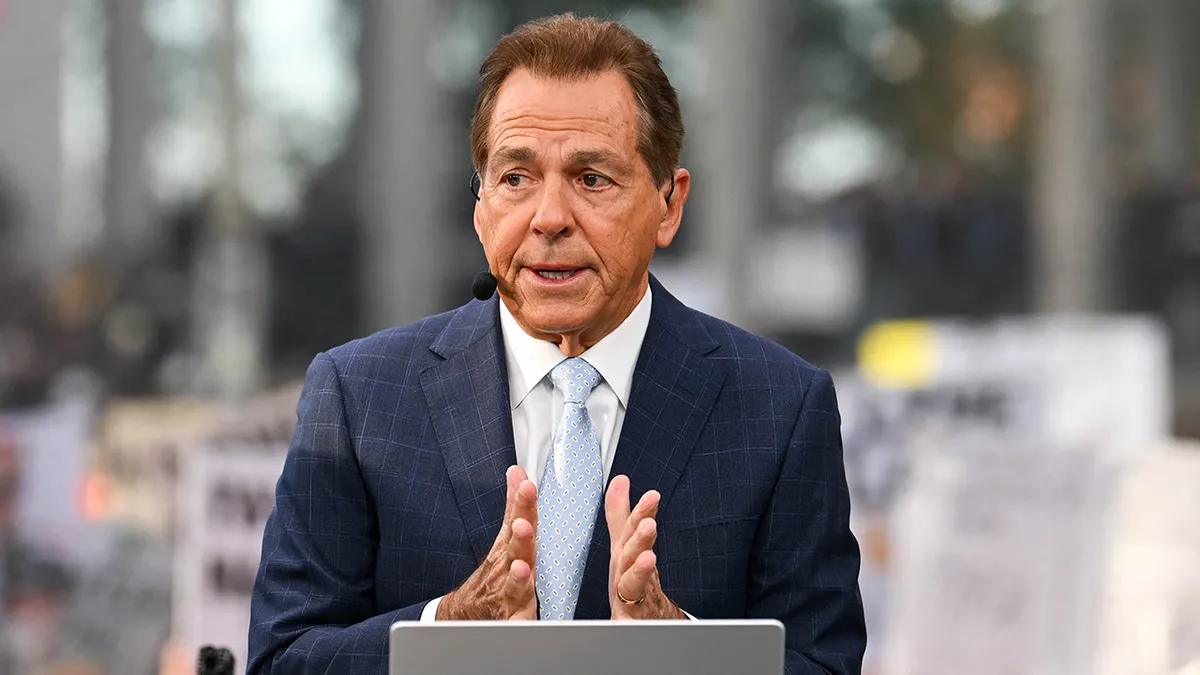 Nick Saban on a TV set