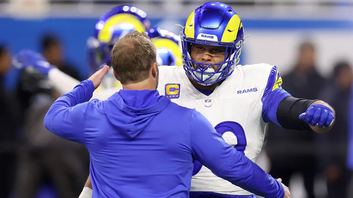 Aaron Donald hugs Sean McVay before an NFL playoff game at Ford Field.