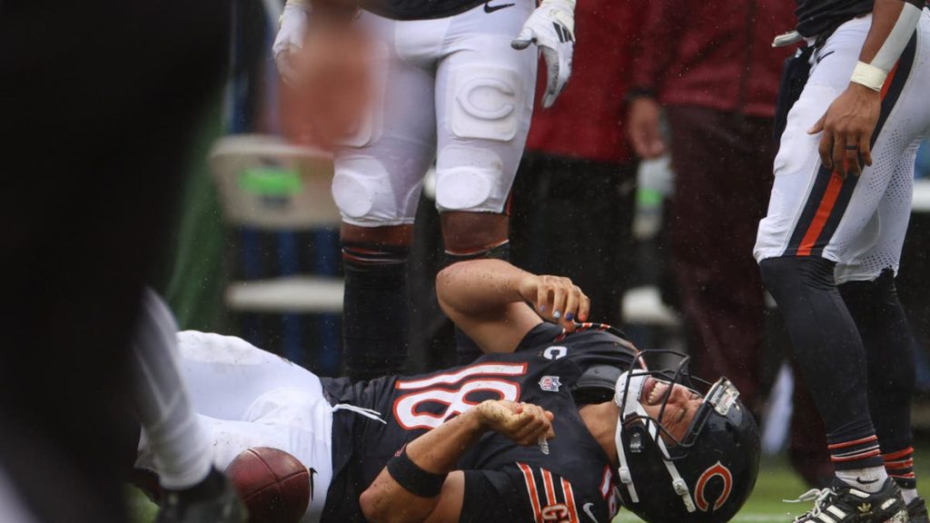 Chicago Bears quarterback Caleb Williams grimaces in pain after going down during a run in the fourth quarter against the Minnesota Vikings on Sunday, Sept. 20, 2026, at Soldier Field in Chicago. (Stacey Wescott/Chicago Tribune/Tribune News Service via Getty Images)