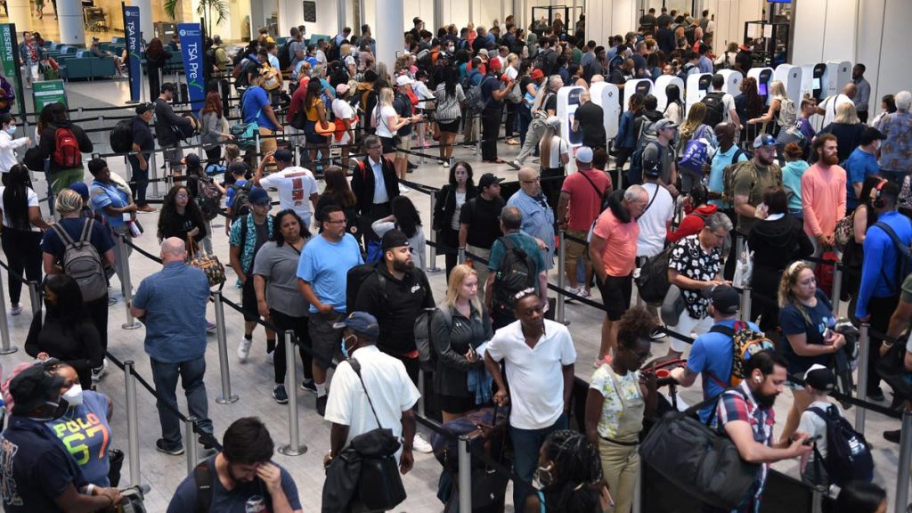 ORLANDO, FLORIDA, UNITED STATES - 2022/07/01: Travelers make their way through a TSA screening line at Orlando International Airport ahead of the July 4 holiday. Hundreds of flights across the county have been delayed or canceled and airlines are warning passengers to prepare for issues. (Photo by Paul Hennessy/SOPA Images/LightRocket via Getty Images)