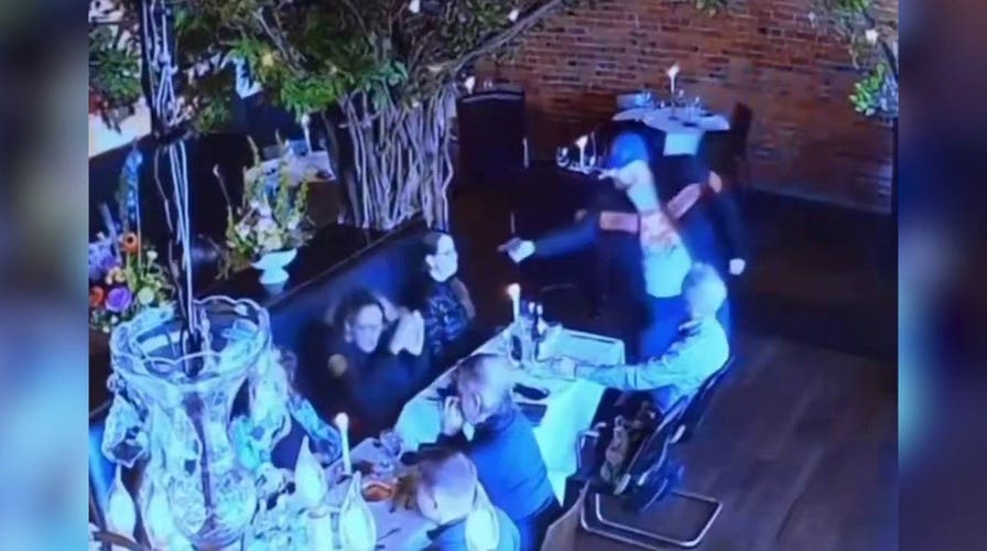 Former attorney allegedly pulls gun on ex-wife in shocking restaurant surveillance video