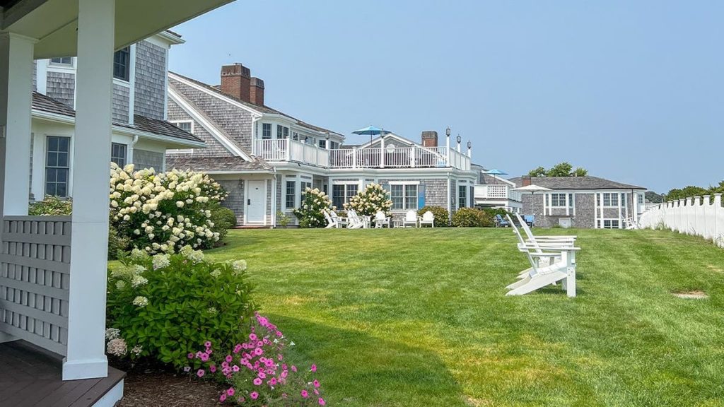 A view of Nantucket beach homes with gray shingles.